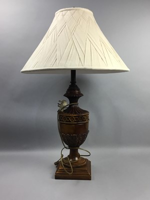 Lot 710a - A REPRODUCTION CARVED WALNUT TABLE LAMP