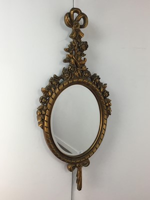 Lot 680 - A REPRODUCTION GILT FRAMED WALL MIRROR