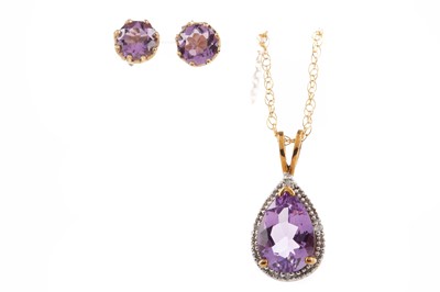 Lot 1229 - AN AMETHYST AND DIAMOND PENDANT AND EARRING SET