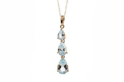 Lot 1231 - A TOPAZ THREE STONE PENDANT
