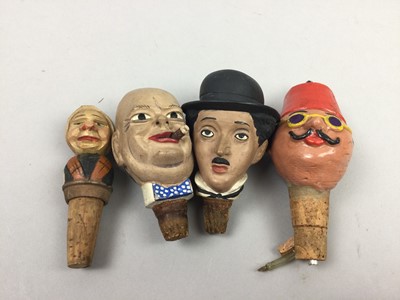 Lot 181 - A GROUP OF NOVELTY CHARACTER HEAD BOTTLE TOPS