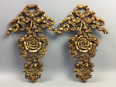 Lot 107 - A SET OF THREE GILDED FOLIATE AND RIBBON WALL APPLIQUES