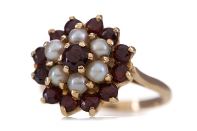 Lot 1257 - A GARNET AND PEARL RING