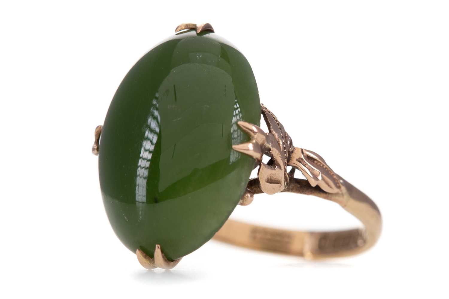 Lot 1258 - A GREEN HARDSTONE RING