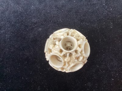 Lot 887 - A CHINESE CARVED IVORY CONCENTRIC PUZZLE BALL