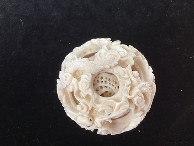 Lot 887 - A CHINESE CARVED IVORY CONCENTRIC PUZZLE BALL
