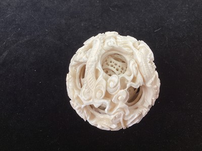 Lot 887 - A CHINESE CARVED IVORY CONCENTRIC PUZZLE BALL