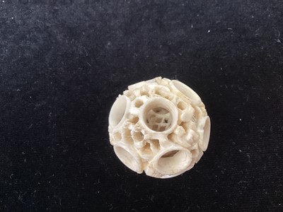 Lot 887 - A CHINESE CARVED IVORY CONCENTRIC PUZZLE BALL