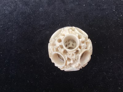 Lot 887 - A CHINESE CARVED IVORY CONCENTRIC PUZZLE BALL