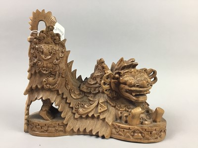 Lot 588 - A CARVED WOOD CHINESE FIGURE OF A DRAGON WITH TWO BOWLS