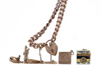 Lot 510 - A GOLD CURB LINK BRACELET AND LOOSE CHARMS