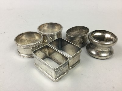 Lot 688 - A LOT OF SIX SILVER NAPKIN RINGS, CONDIMENT SET, PLAQUE AND PILL BOX