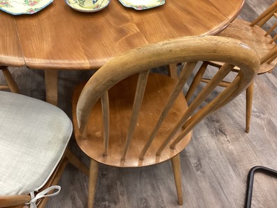 Lot 363 - AN ERCOL DINING TABLE AND SIX HOOP BACK CHAIRS