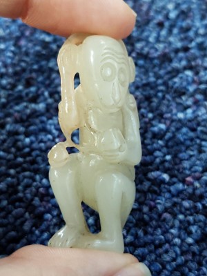 Lot 1081 - A CHINESE MUTTON JADE CARVING OF A MONKEY