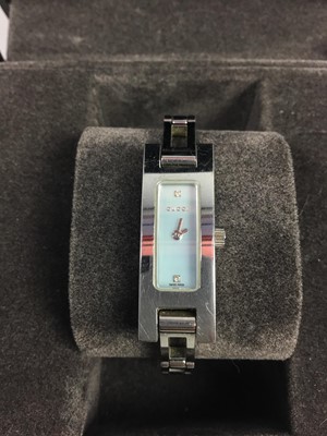 Lot 65 - A GUCCI LADIES FASHION WATCH ALONG WITH TWO OTHER LADIES FASHION WATCHES