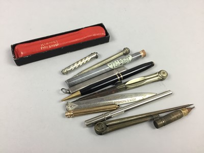 Lot 23 - A SILVER CASED PENCIL ALONG WITH PENS AND PENCILS