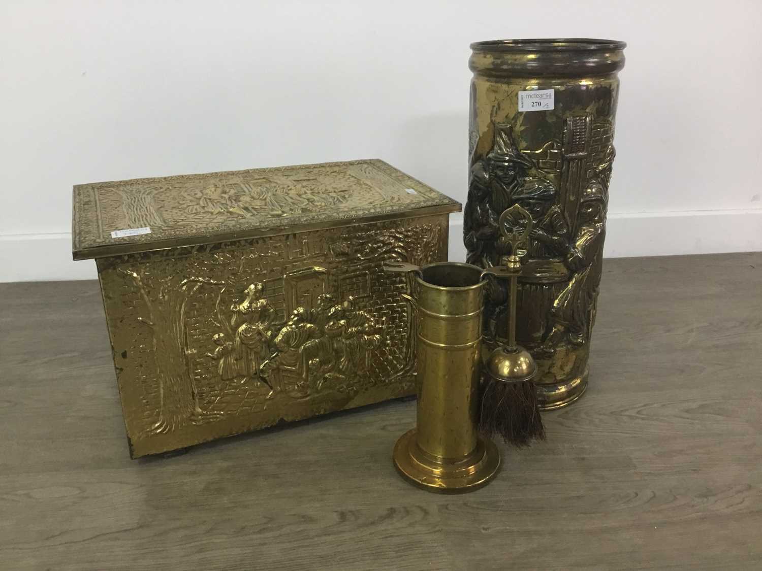 Lot 270 - AN EMBOSSED BRASS LOG BOX AND STICK STAND