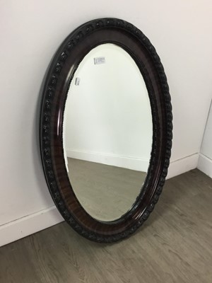 Lot 277 - A 20TH CENTURY OVAL WALL MIRROR AND A BEDSIDE CABINET