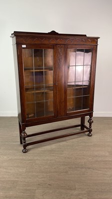 Lot 309 - AN OAK TWO DOOR BOOKCASE