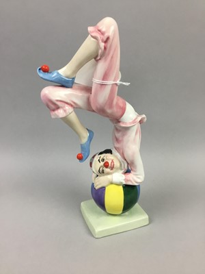 Lot 321 - A ROYAL DOULTON FIGURE OF 'TUMBLING' AND TWO OTHER FIGURES