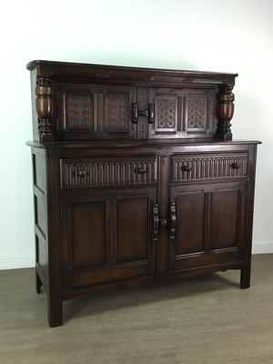 Lot 404 - A STAINED WOOD DRESSER