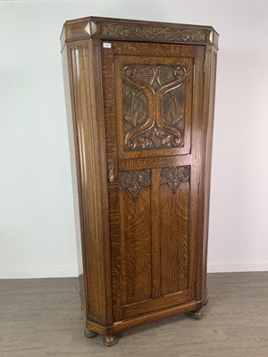 Lot 439 - AN ARTS & CRAFTS OAK HALL CUPBOARD