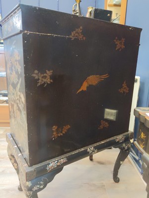 Lot 1152 - A CHINESE LACQUERED AND INLAID CABINET ON STAND