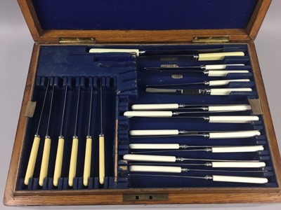 Lot 29 - AN OAK CANTEEN OF SILVER PLATED CUTLERY