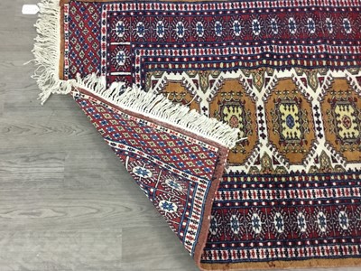 Lot 19 - A BOKHARA TYPE RUG AND TWO SMALLER RUGS
