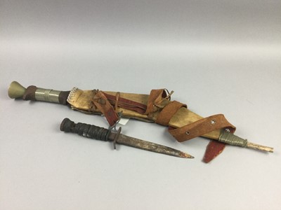 Lot 16 - AN AFRICAN TRIBAL CURVED SWORD AND A DAGGER