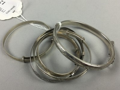 Lot 424 - A LOT OF FIVE SILVER CHRISTENING BANGLES