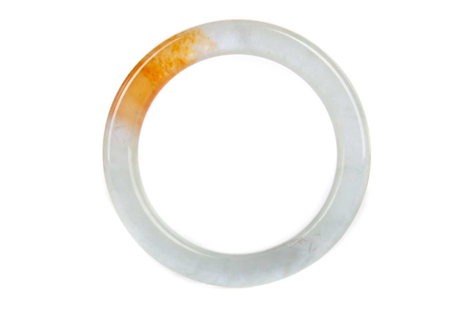 Lot 1162 - A CHINESE CARVED JADE BANGLE