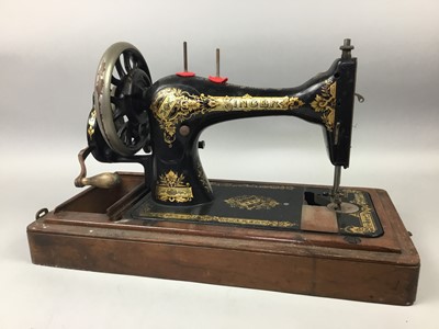 Lot 418 - A CASED SINGER SEWING MACHINE