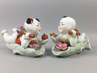 Lot 67 - A PAIR OF CHINESE BISQUE PORCELAIN CHILD FIGURES