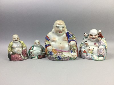 Lot 88 - A GROUP OF FOUR CHINESE CERAMIC BUDHAI AND A FIGURE OF SHOU LAO