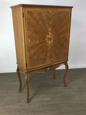 Lot A CONTINENTAL MARQUETRY INLAID COCKTAIL CABINET IN THE MANNER OF EPSTEIN