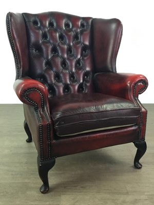 Lot 211 - A 20TH CENTURY WING BACKED ARMCHAIR