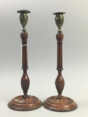 Lot 212 - A PAIR OF 19TH CENTURY MAHOGANY CANDLESTICKS