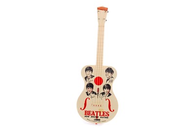 Lot 983 - A BEATLES NEW SOUND TOY GUITAR BY SELCOL