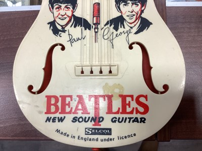 Lot 983 - A BEATLES NEW SOUND TOY GUITAR BY SELCOL