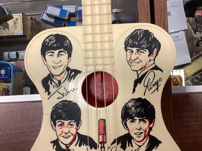 Lot 983 - A BEATLES NEW SOUND TOY GUITAR BY SELCOL