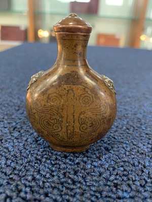 Lot 1194 - A CHINESE COPPER ALLOY SNUFF BOTTLE
