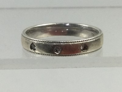 Lot 291 - A DIAMOND SET BAND, TWO OTHERS AND A BANGLE