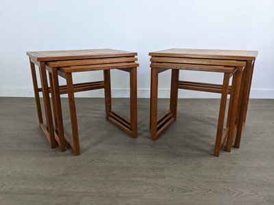 Lot 312 - A PAIR OF TEAK TILE TOPPED NESTS OF TABLES