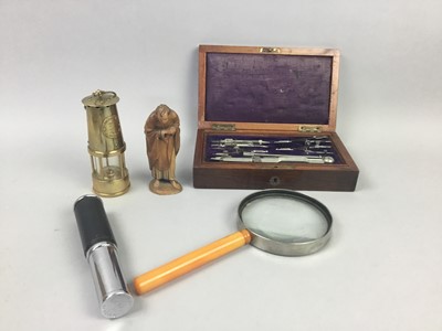Lot 34 - A DRAUGHTSMAN'S SET, MINERS LAMP, MAGNIFYING GLASS, TWO FIGURES AND OTHER ITEMS