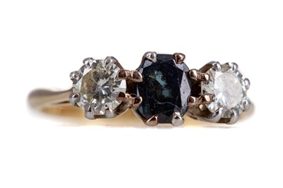 Lot 484 - A SAPPHIRE AND DIAMOND THREE STONE RING