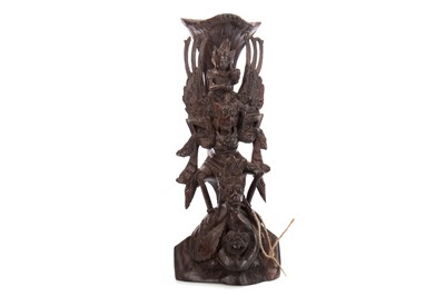 Lot 1042 - A CARVED BALINESE DEITY GROUP