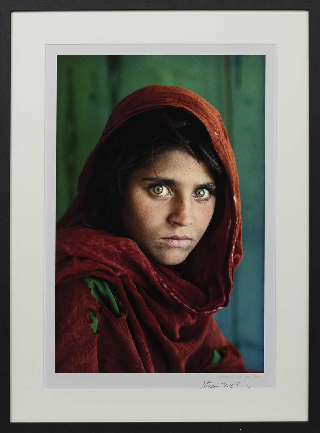 Lot 160 - SHARBAT GULA, AFGHAN GIRL, PAKISTAN, A SIGNED LITHOGRAPH BY STEVE MCCURRY