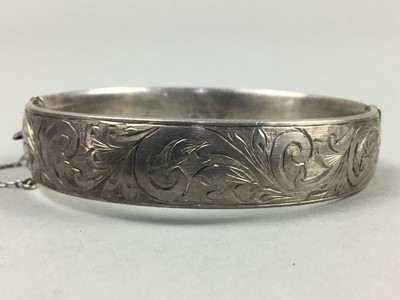 Lot 224 - AN ENGRAVED SILVER BANGLE AND BRACELETS