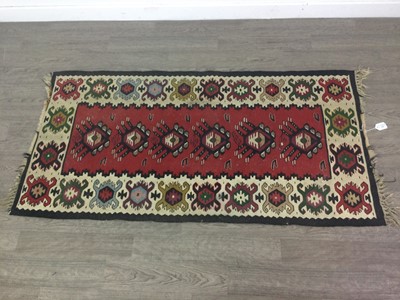 Lot 258 - A KILIM RUG